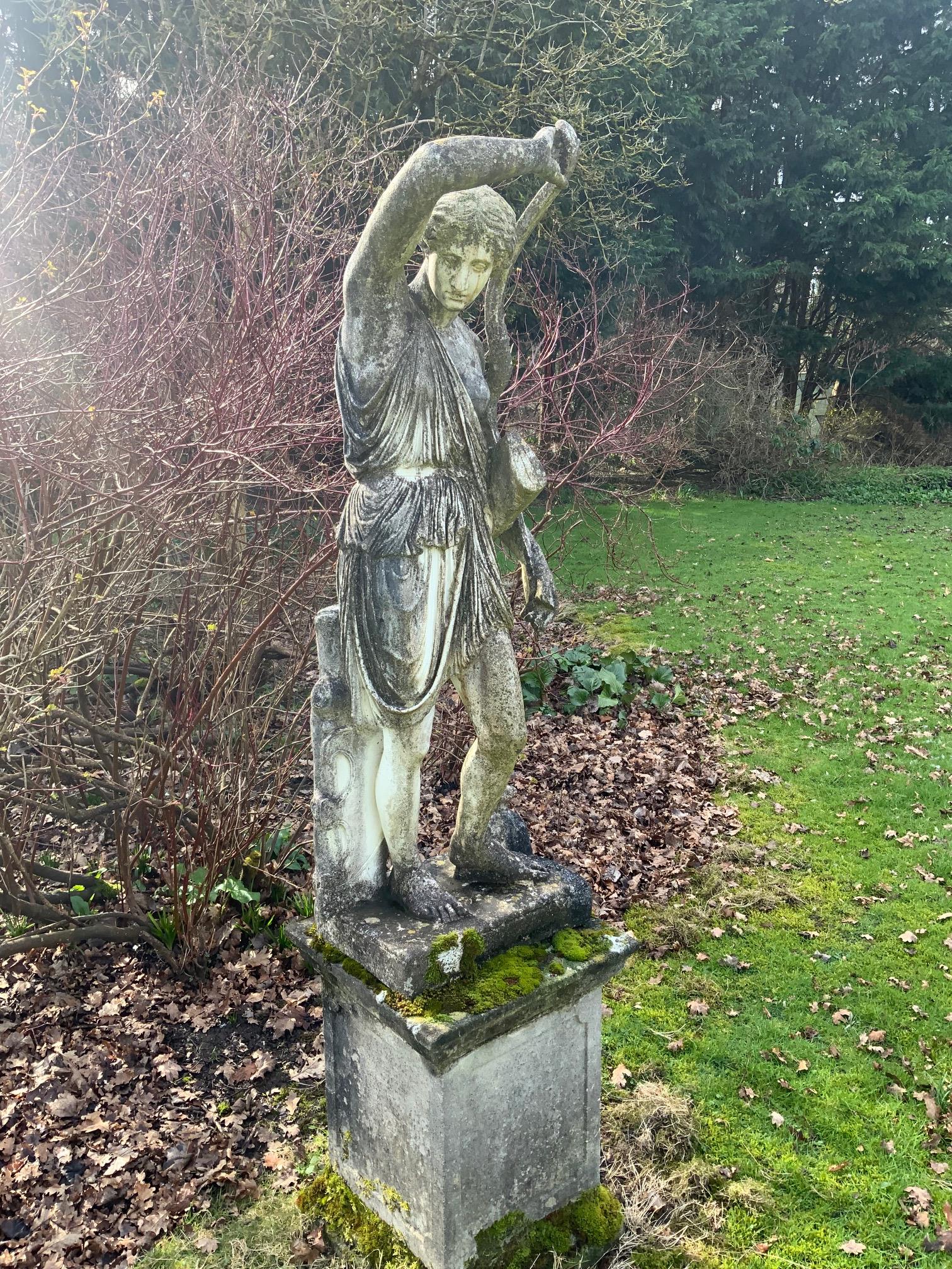 An Italian composition marble statue of Diana the Huntress, on a square reconstituted stone plinth